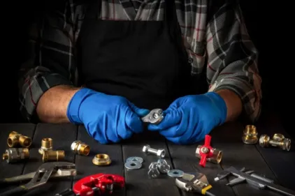 An HVAC contractor configures components for an AC replacement.