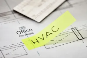 HVAC company plans sitting on a desk. 