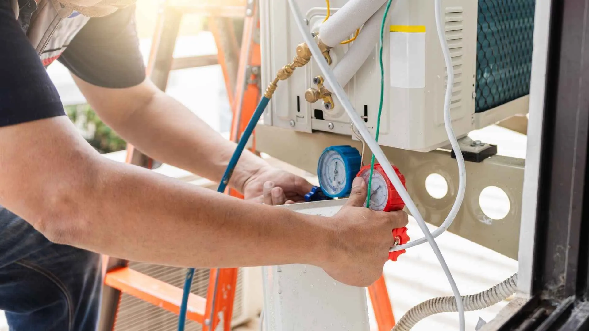 A photo of an HVAC maintenance technician working.